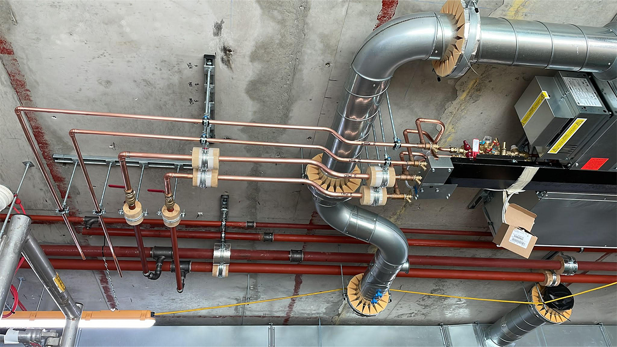 Commercial heating project with energy efficient Low-Temperature Hot Water (LTHW) with pipes and ducting